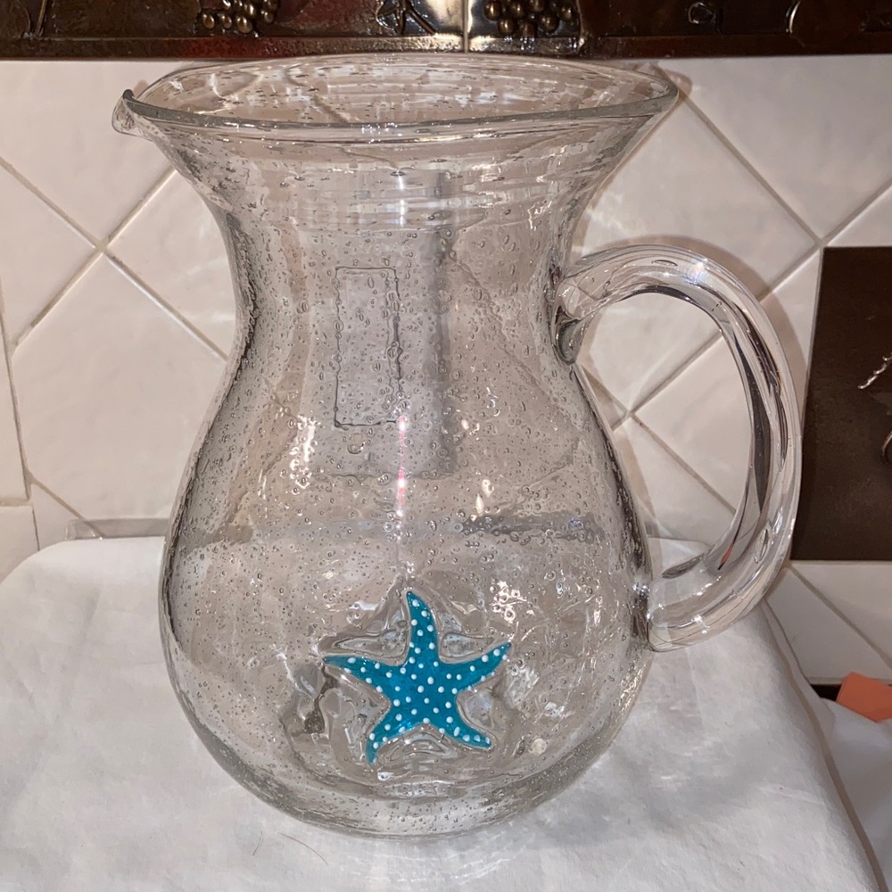 Hand blown Mexican bubble glass pitcher with blue starfish